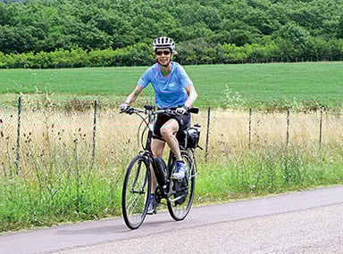 enjoying an e-bike on her vbt vacation