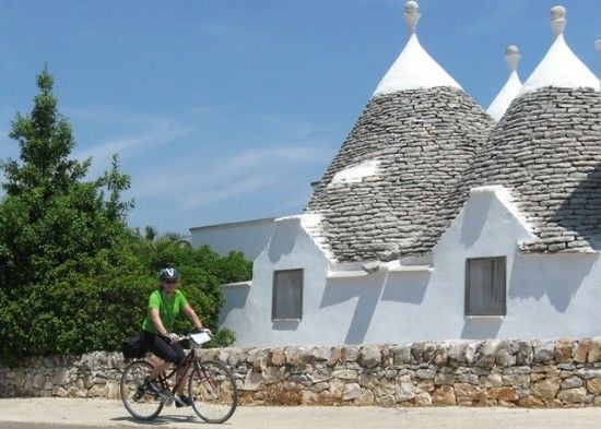 Trulli_Anne biking past Trulli a